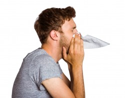 A man blowing nose